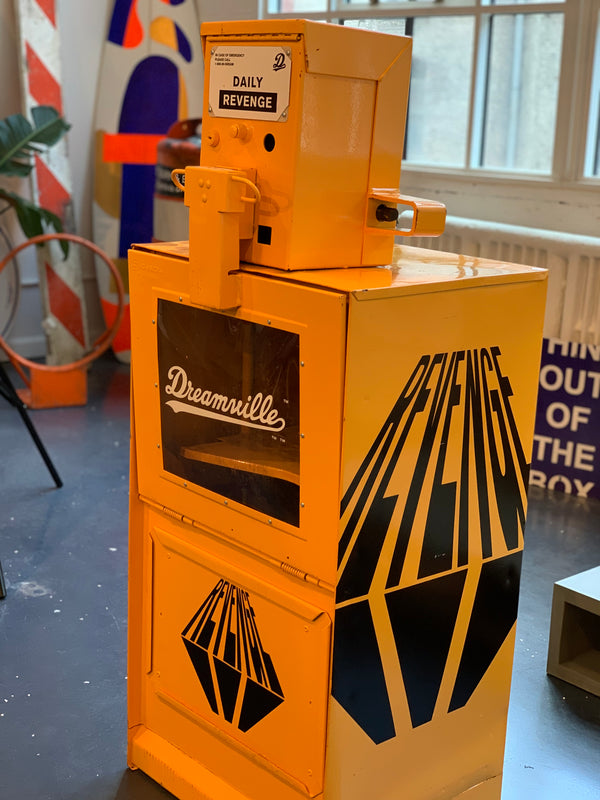Newspaper box display inside of a store for a record release brand activation
